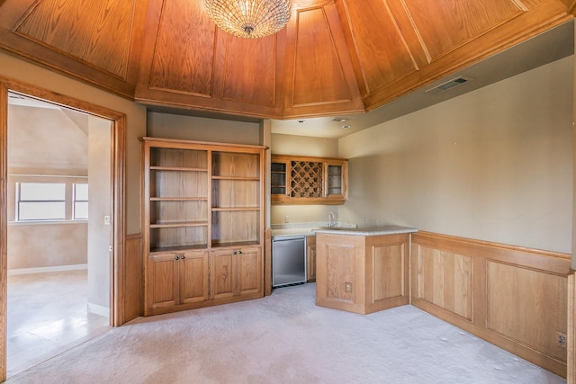 kitchen featuring light carpet, stainless steel dishwasher, and wooden ceiling