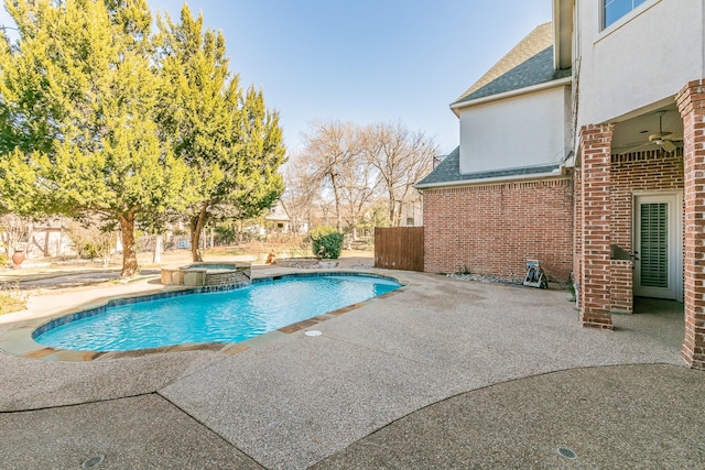 view of swimming pool featuring a patio area, ceiling fan, and an in ground hot tub