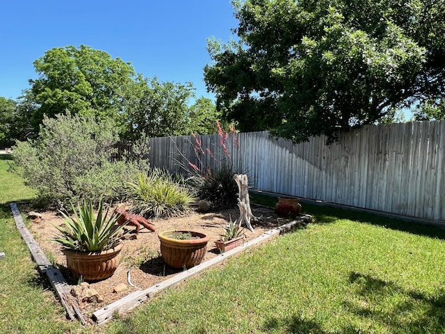 view of yard with a fenced backyard