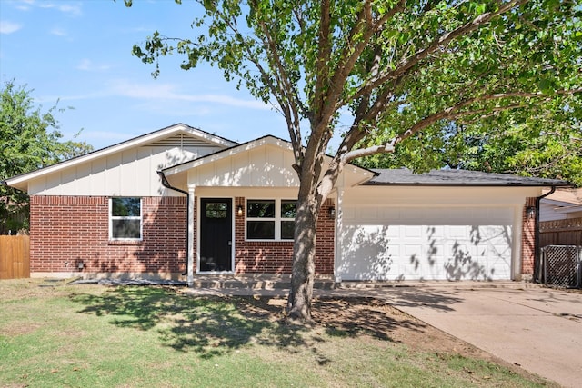 ranch-style home with a garage and a front lawn