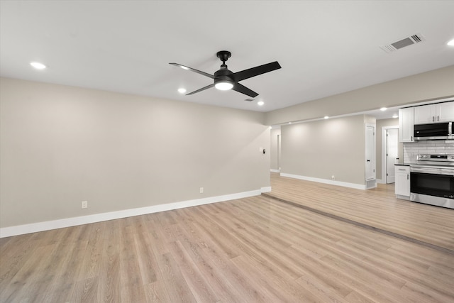 unfurnished living room with light hardwood / wood-style flooring and ceiling fan