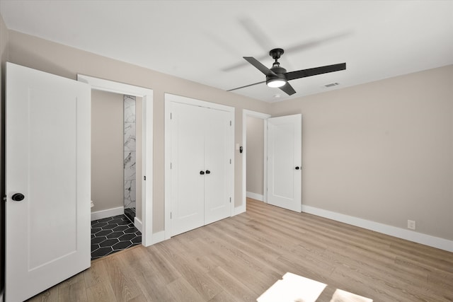 unfurnished bedroom featuring light hardwood / wood-style flooring and ceiling fan