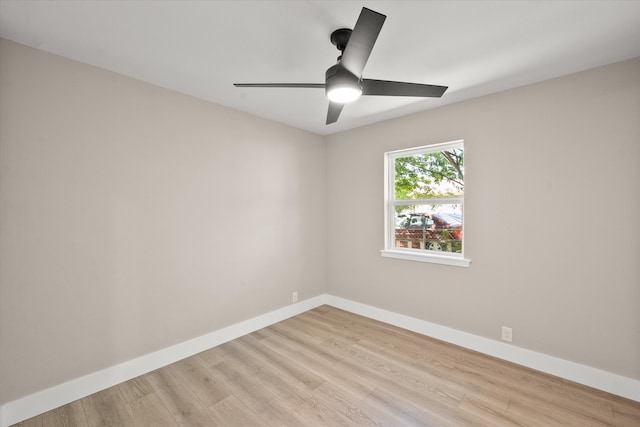 empty room with ceiling fan and light wood-type flooring