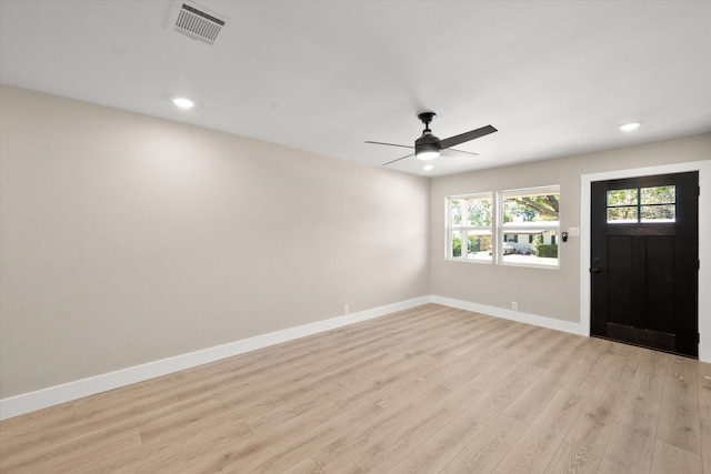 foyer entrance with ceiling fan and light hardwood / wood-style flooring