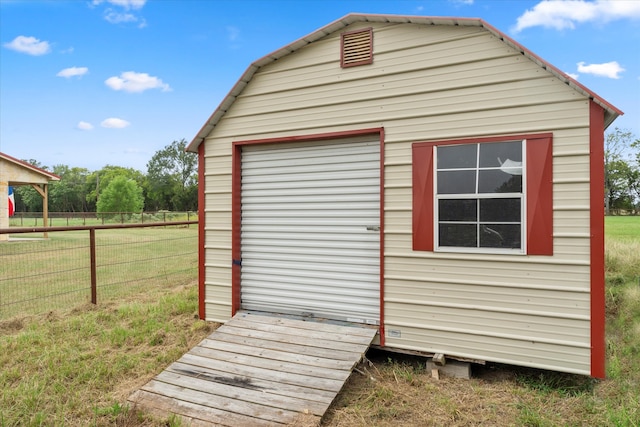 view of outbuilding with a lawn