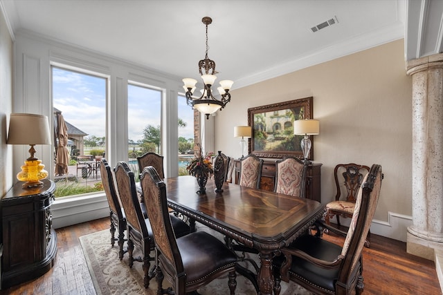 dining area featuring crown molding, a wealth of natural light, and dark hardwood / wood-style floors