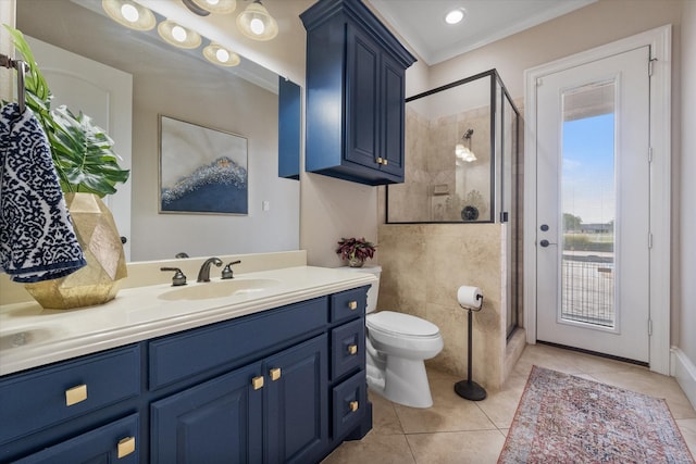 bathroom featuring a shower with door, toilet, vanity, crown molding, and tile patterned flooring