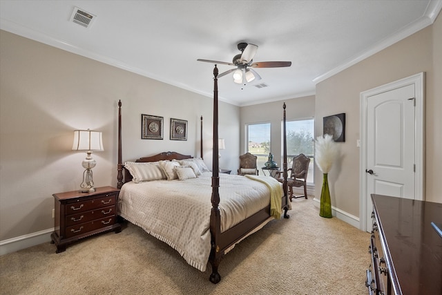 carpeted bedroom featuring crown molding and ceiling fan