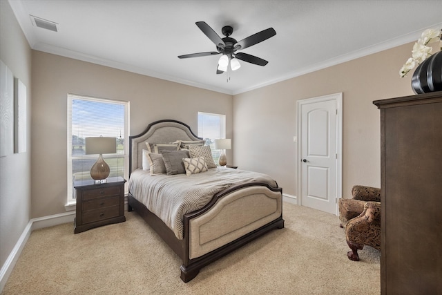 bedroom with multiple windows, light colored carpet, crown molding, and ceiling fan