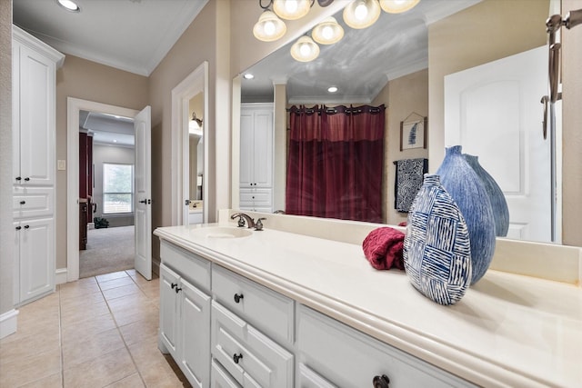 bathroom with recessed lighting, vanity, ornamental molding, and tile patterned floors