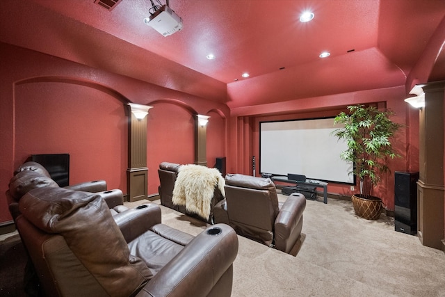 carpeted cinema room featuring ornate columns