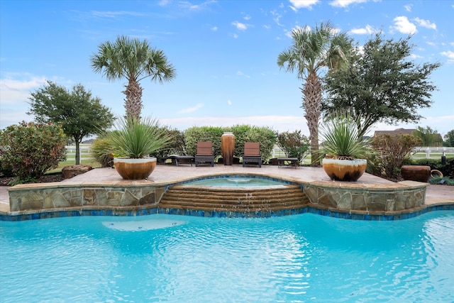 view of pool with an in ground hot tub