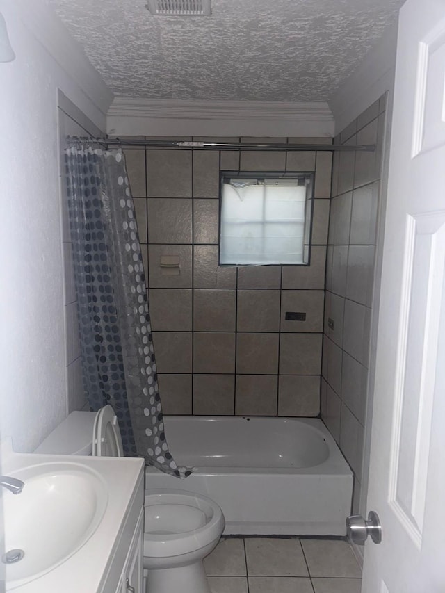 full bathroom with tile patterned flooring, vanity, toilet, shower / bath combo, and a textured ceiling