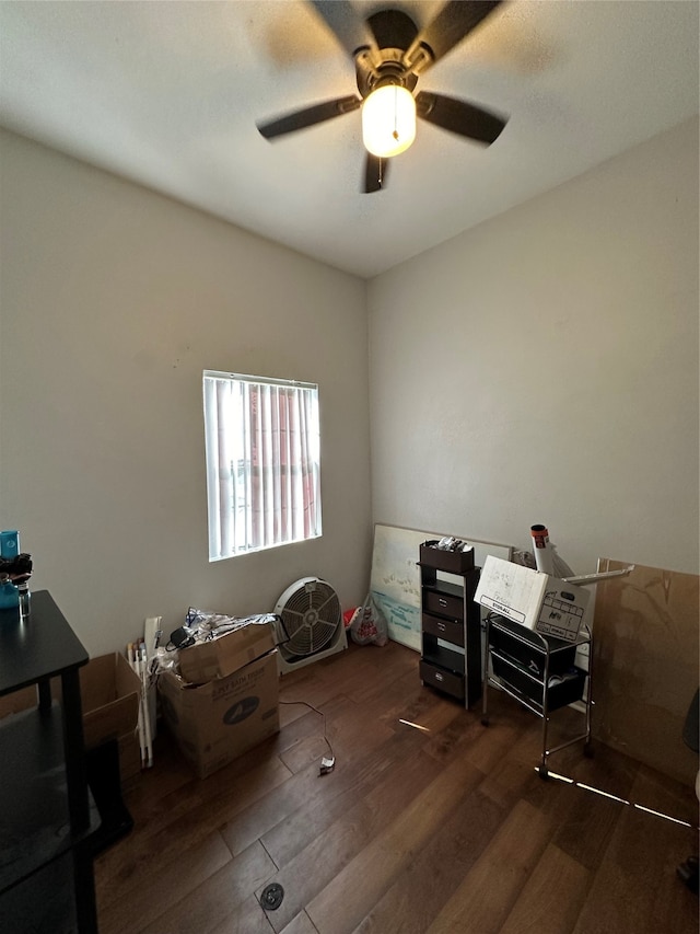 misc room featuring dark wood-type flooring and ceiling fan