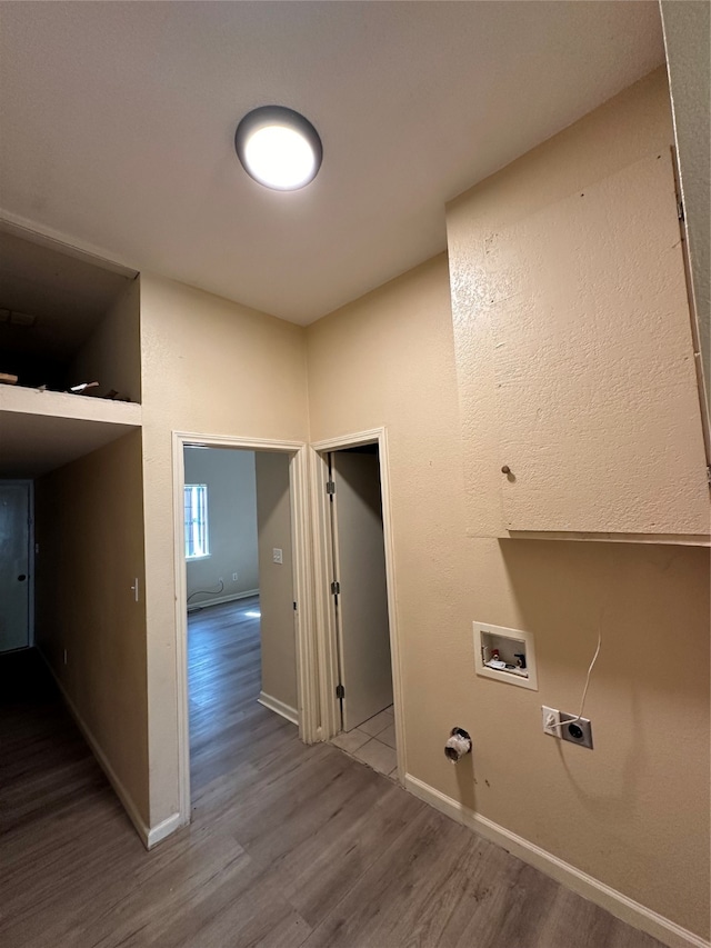 washroom with washer hookup, wood-type flooring, hookup for a gas dryer, and hookup for an electric dryer