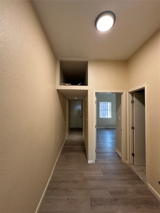 corridor featuring wood-type flooring