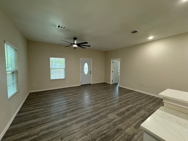 foyer featuring ceiling fan and dark hardwood / wood-style floors