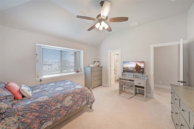 bedroom with ceiling fan, light colored carpet, and vaulted ceiling