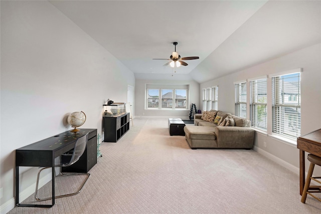 living room featuring lofted ceiling, ceiling fan, and carpet