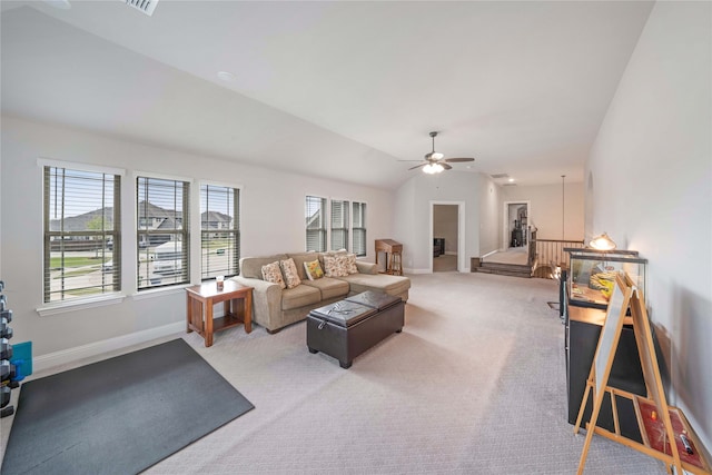 carpeted living room with lofted ceiling and ceiling fan