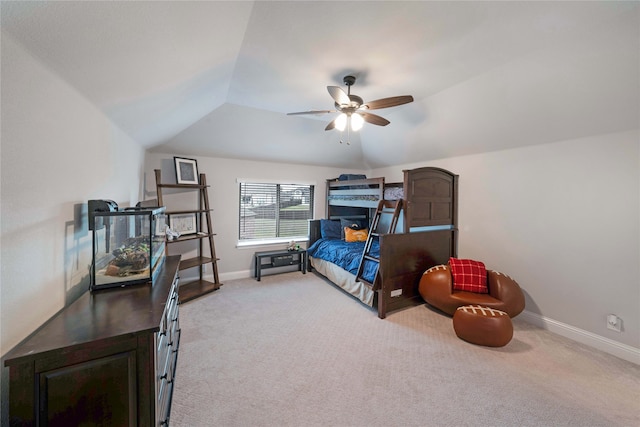 carpeted bedroom featuring ceiling fan and vaulted ceiling