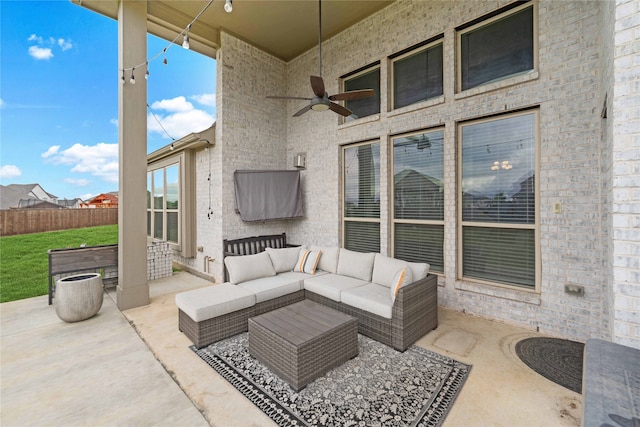 view of patio with outdoor lounge area and ceiling fan