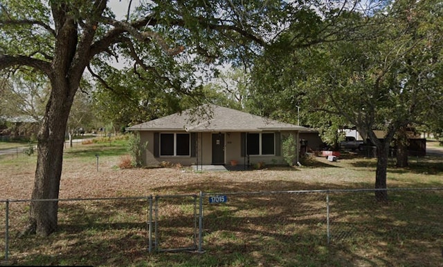 ranch-style home featuring a front yard