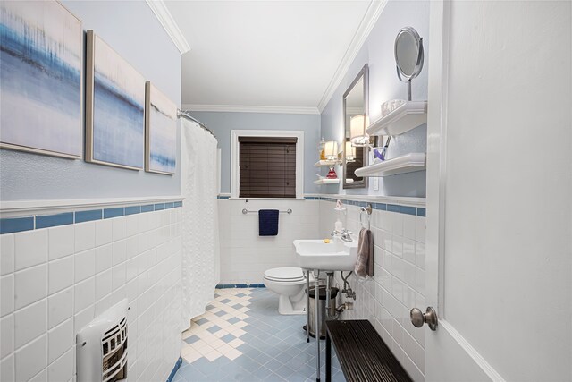 bathroom featuring heating unit, toilet, sink, tile walls, and ornamental molding