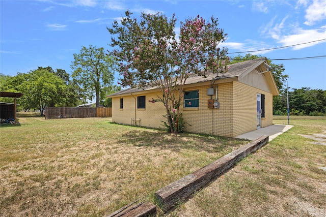 view of home's exterior featuring a yard