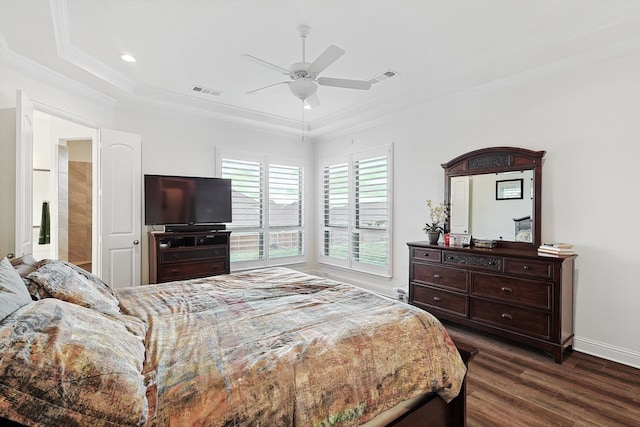 bedroom with ornamental molding, ceiling fan, and dark wood-type flooring