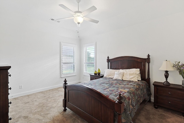 bedroom featuring dark carpet and ceiling fan