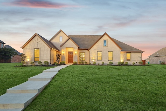 view of front of house with a lawn