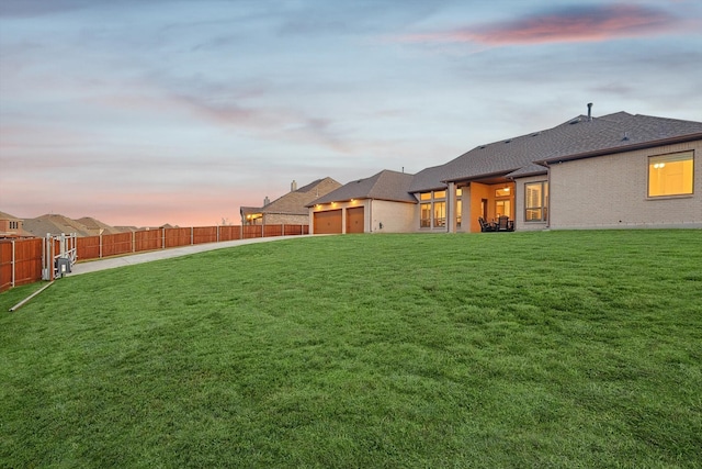 view of yard at dusk