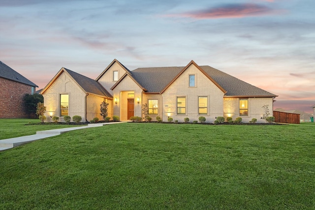 view of front of home with a yard