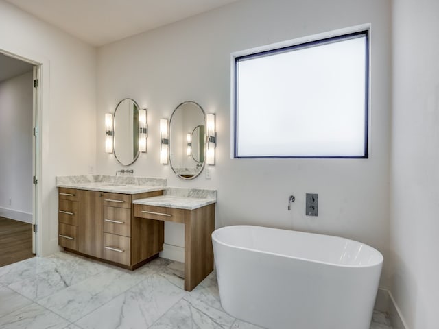 bathroom featuring vanity and a bathtub