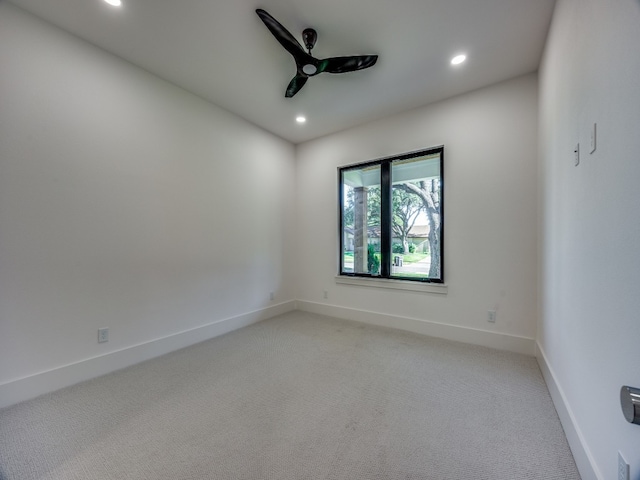 empty room with carpet flooring and ceiling fan