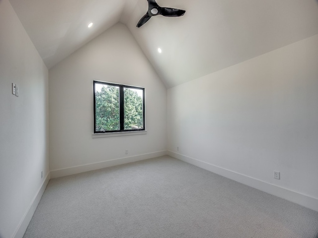 interior space featuring lofted ceiling and carpet floors