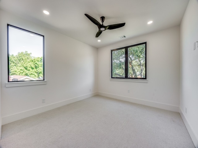 empty room featuring carpet and ceiling fan