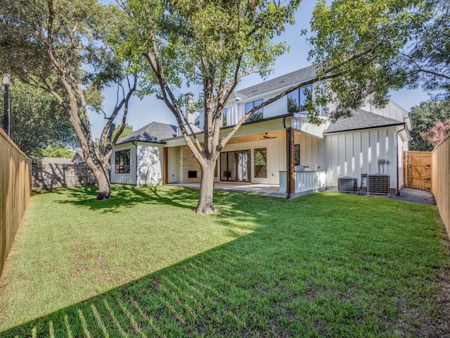 rear view of house with a lawn, a patio area, ceiling fan, and central air condition unit