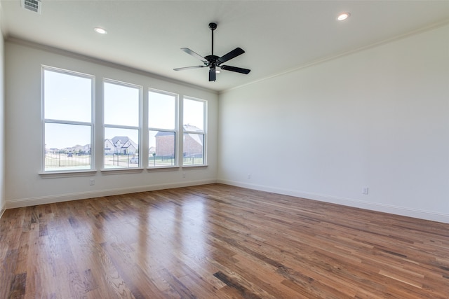 unfurnished room featuring ceiling fan, crown molding, and wood-type flooring