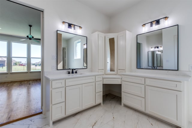 bathroom with vanity, ceiling fan, and hardwood / wood-style flooring