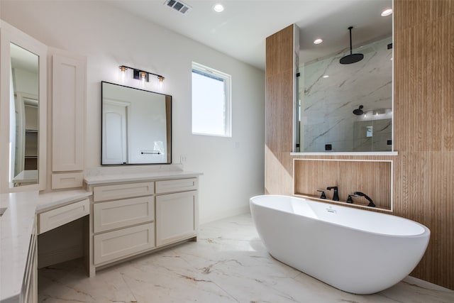 bathroom featuring shower with separate bathtub and vanity