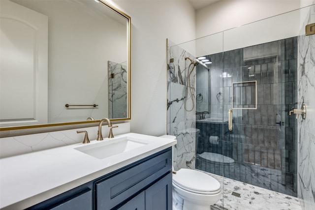 bathroom featuring a shower with door, toilet, and vanity