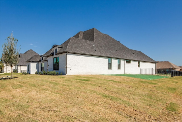 1140 Macgregor Ln, Gunter, TX 75058 - back of property featuring brick siding and roof with shingles