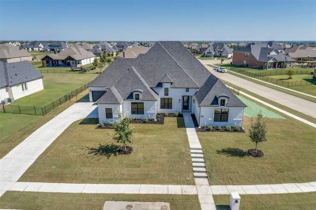 1140 Macgregor Ln, Gunter, TX 75058 - view of front facade featuring roof with shingles, a residential view, and concrete driveway