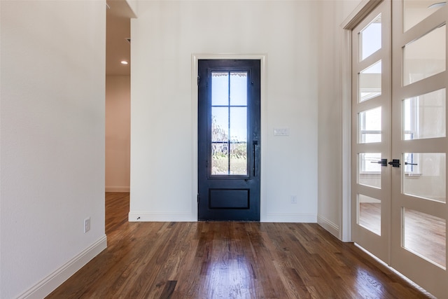 doorway featuring dark hardwood / wood-style floors and french doors