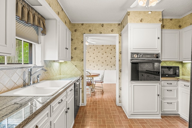 kitchen with black appliances, ceiling fan, sink, and white cabinetry