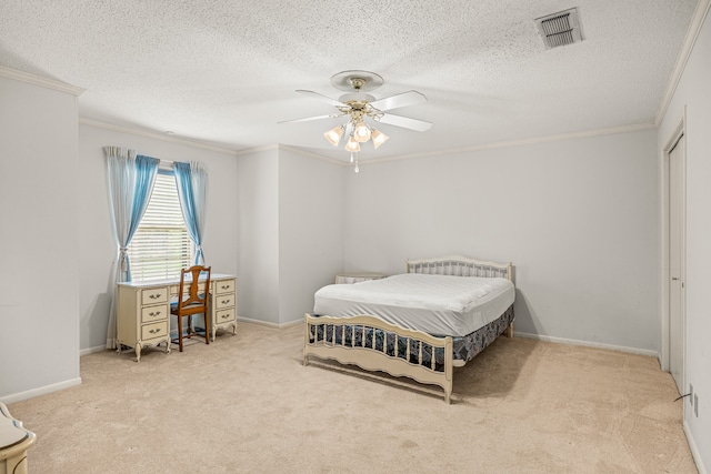 bedroom featuring light colored carpet, ceiling fan, and a textured ceiling