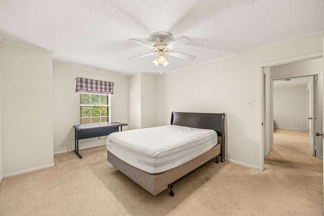 bedroom featuring crown molding, light colored carpet, ceiling fan, and a textured ceiling