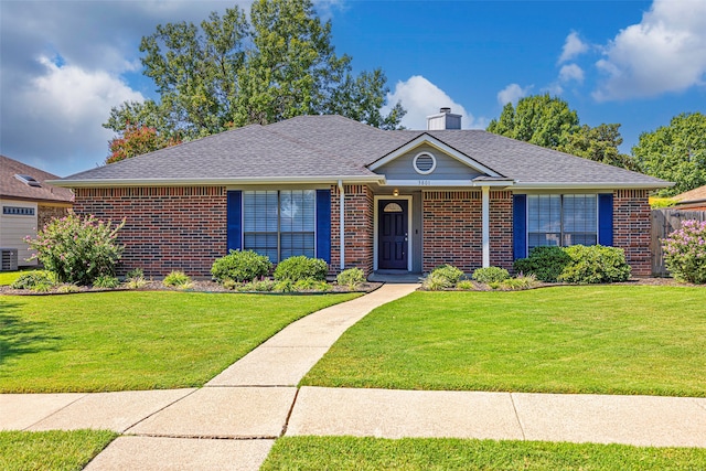 ranch-style house featuring central AC unit and a front lawn